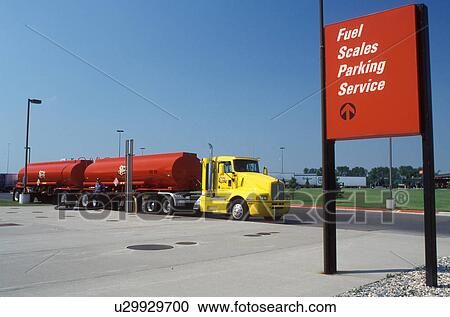 gas, truck, ND, North Dakota, Fargo, Red fuel truck with yellow cab fills gas into underground tanks at a gas station. View Large Photo Image Stock Image - gas, truck, ND, North Dakota, Fargo, Red fuel truck with yellow cab fills gas into underground tanks at a gas station.. Fotosearch