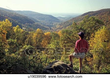 Georgia, GA, Woman standing at overlook at Walasi-Yi Visitor Center at Neel's Gap looking at mountains in the Chattahoochee National Forest in the fall in northern Georgia View Large Photo Image Stock Photograph - Georgia, GA, Woman standing at overlook at Walasi-Yi Visitor Center at Neel's Gap looking at mountains in the Chattahoochee National Forest in the fall in northern Georgia . Fotosearch