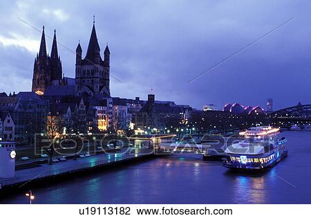 Germany, Cologne, Koln, Nordrhein-Westfalen, Rhine River, Europe, Scenic view of the city of Cologne (Koln) and the Cologne Cathedral (Dom) along the Rhine River in the evening. View Large Photo Image Stock Image - Germany, Cologne, Koln, Nordrhein-Westfalen, Rhine River, Europe, Scenic view of the city of Cologne (Koln) and the Cologne Cathedral (Dom) along the Rhine River in the evening.. Fotosearch