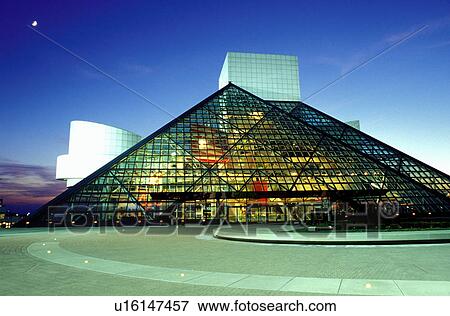 Stock Photo -  hall of fame, rock 'n roll, Cleveland, OH, Ohio, Moonrise over the Rock and Roll Hall of Fame and Museum in the evening.. Fotosearch