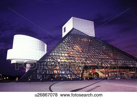 Stock Photo -  hall of fame, rock 'n roll, Cleveland, OH, Ohio, Rock and Roll Hall of Fame and Museum is illuminated at night.. Fotosearch