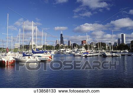 Stock Image -  harbor, marina, Chicago, Illinois, IL, Downtown skyline of Chicago from Burnham Point Yacht Club on Lake Michigan.. Fotosearch
