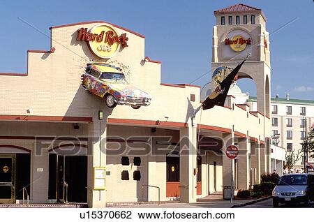 Stock Image -  Hard Rock CafT, Niagara Falls, NY, New York, Front of and old Cadillac mounted on the fatade of the Hard Rock CafT building in Niagara Falls.. Fotosearch