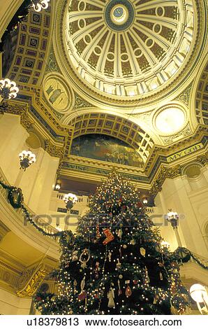 Stock Image -  Harrisburg, State Capitol, State House, Pennsylvania, PA, A beautiful Christmas tree decorates The Capitol Rotunda inside The Pennsylvania State Capitol Building in the capital city of Harrisburg.. Fotosearch