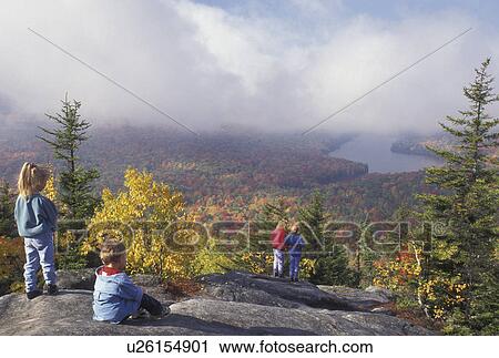 hiking, fall, overlook, aerial, Groton State Forest, VT, Vermont, People look at the view of Kettle Pond and the colorful fall foliage of the forest from Owl's Head Overlook in Groton State Forest in the autumn. View Large Photo Image Stock Image - hiking, fall, overlook, aerial, Groton State Forest, VT, Vermont, People look at the view of Kettle Pond and the colorful fall foliage of the forest from Owl's Head Overlook in Groton State Forest in the autumn.. Fotosearch