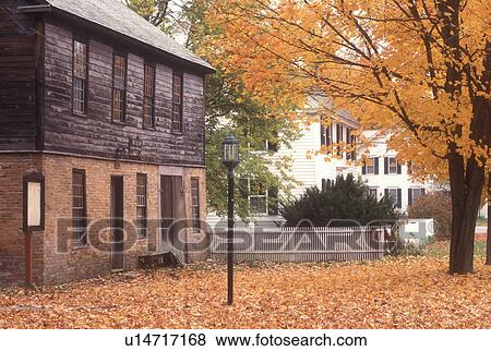 Stock Photo -  historic, fall, East Poultney, VT, Vermont, Poultney Historical Society Museum is surrounded by a carpet of colorful maple leaves in autumn East Poultney.. Fotosearch