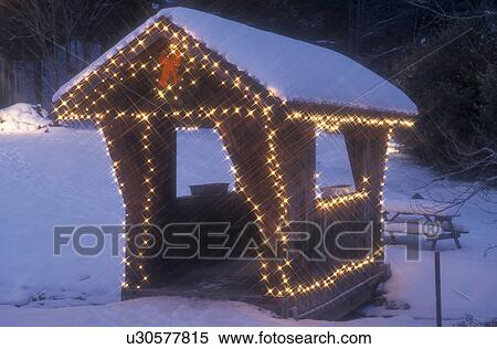holiday, covered bridge, Christmas, winter, A small covered bridge at The Mountain Road Resort in the ski resort of Stowe is trimmed with tiny white lights and a big red bow for the Christmas holiday season on a snow covered night in Lamoille County in t View Large Photo Image Stock Photography - holiday, covered bridge, Christmas, winter, A small covered bridge at The Mountain Road Resort in the ski resort of Stowe is trimmed with tiny white lights and a big red bow for the Christmas holiday season on a snow covered night in Lamoille County in t. Fotosearch