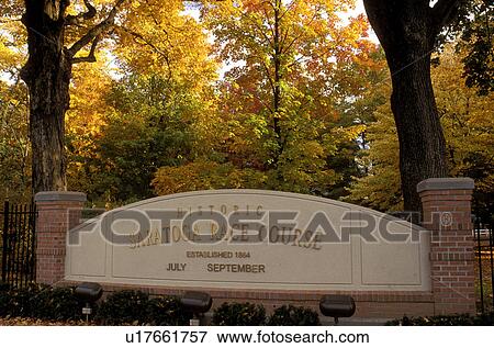 Stock Photo -  horse racing, Saratoga Springs, New York, NY, Entrance sign to the Historic Saratoga Race Course in Saratoga Springs in the autumn.. Fotosearch