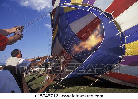 hot air balloon, Vermont, VT, Essex Junction, Inflating a hot air balloon at the Champlain Valley Balloon and Craft Festival. View Large Photo Image Stock Image - hot air balloon, Vermont, VT, Essex Junction, Inflating a hot air balloon at the Champlain Valley Balloon and Craft Festival.. Fotosearch