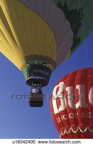 Stock Image -  hot air balloon, Vermont, VT, Essex Junction, The Vermont hot air balloon rising at the Champlain Valley Balloon and Craft Festival.. Fotosearch