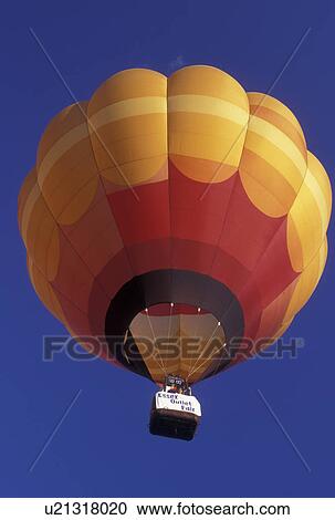 hot air balloon, Vermont, VT, Essex Junction, A hot air balloon rising above the Champlain Valley Balloon and Craft Festival. View Large Photo Image Stock Image - hot air balloon, Vermont, VT, Essex Junction, A hot air balloon rising above the Champlain Valley Balloon and Craft Festival.. Fotosearch