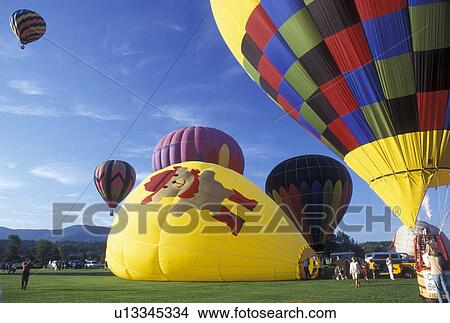 Picture -  hot air balloon, Vermont, VT, Stowe, Hot air balloons getting ready for take off at the Stoweflake Hot Air Balloon Festival.. Fotosearch