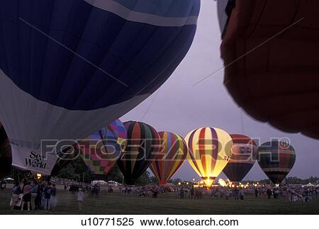 Stock Photography -  hot air balloons, Vermont, VT, Essex Junction, Balloon glow at the Champlain Valley Balloon and Craft Festival.. Fotosearch