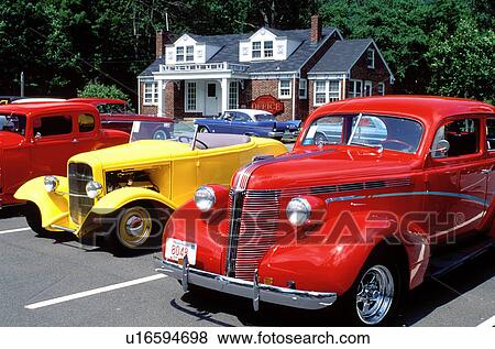Stock Photo -  hot rod, hotrod, antique cars, Catskill Mountains, Mount Tremper, New York, Antique car club displays antique cars in a parking lot.. Fotosearch