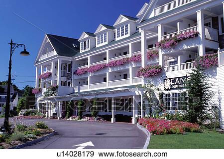 Stock Photo -  hotel, inn, lodge, resort, New Hampshire, Meredith, NH, Beautiful flowers decorate The Chase House at The Inn at Mill Falls.. Fotosearch