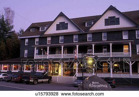 Stock Photo -  hotel, inn, Long Lake, New York, NY, Adirondacks, Adirondack Hotel in the evening at Long Lake in the Adirondacks.. Fotosearch
