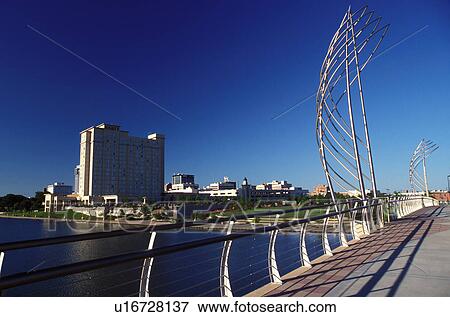 Stock Photo -  hotel, Wichita, KS, Kansas, View of the Hyatt Regency Hotel in downtown Wichita along the Big Arkansas River.. Fotosearch