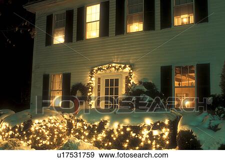 house, Christmas, holiday, decorations, lights, snow, winter, A historic house in downtown Woodstock is decorated with white lights for the Christmas holiday season at night in Windsor County in the state of Vermont. View Large Photo Image Stock Photo - house, Christmas, holiday, decorations, lights, snow, winter, A historic house in downtown Woodstock is decorated with white lights for the Christmas holiday season at night in Windsor County in the state of Vermont. . Fotosearch