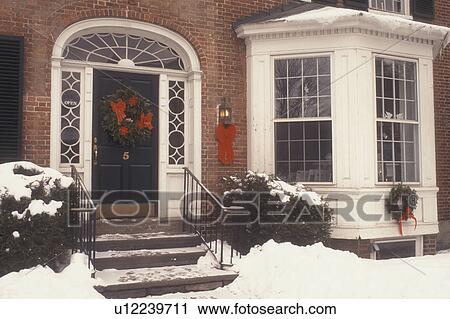 house, home, Christmas, wreaths, ribbon, bow, holiday, decorations, snow, winter, The front of an historical home in downtown Woodstock is decorated with a wreath and red bows for the Christmas holiday season in Windsor County in the state of Vermont. View Large Photo Image Stock Image - house, home, Christmas, wreaths, ribbon, bow, holiday, decorations, snow, winter, The front of an historical home in downtown Woodstock is decorated with a wreath and red bows for the Christmas holiday season in Windsor County in the state of Vermont. . Fotosearch
