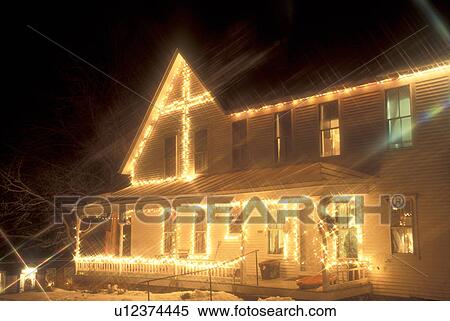 house, home, decorations, Christmas, holiday, snow, winter, A house in East Corinth is decorated with white lights for the Christmas holiday season at night in Orange County in the state of Vermont. View Large Photo Image Stock Photography - house, home, decorations, Christmas, holiday, snow, winter, A house in East Corinth is decorated with white lights for the Christmas holiday season at night in Orange County in the state of Vermont. . Fotosearch