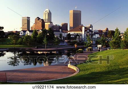 Picture -  Indianapolis, skyline, canal, IN, Indiana, Reflection of the downtown skyline of Indianapolis in the calm waters of Historic Central Canal.. Fotosearch