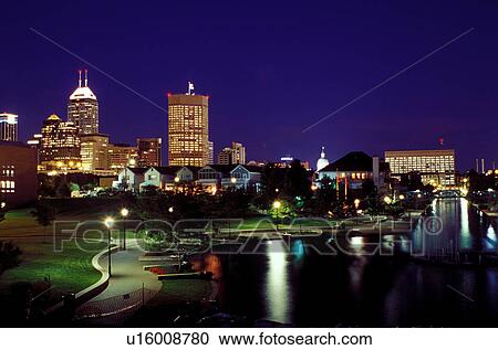Stock Image -  Indianapolis, skyline, canal, IN, Indiana, Downtown skyline of Indianapolis from Historic Central Canal in the evening.. Fotosearch
