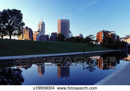 Indianapolis, skyline, canal, park, IN, Indiana, Reflection of the downtown skyline of Indianapolis in the calm waters of Historic Central Canal. View Large Photo Image Picture - Indianapolis, skyline, canal, park, IN, Indiana, Reflection of the downtown skyline of Indianapolis in the calm waters of Historic Central Canal.. Fotosearch