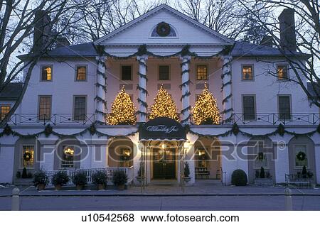 Stock Photo -  inn, Colonial Williamsburg, Virginia, VA, Williamsburg, Christmas decorations outside Williamsburg Inn in the evening.. Fotosearch