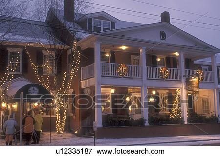 Stock Photo -  inn, country inn, B&B, resort, hotel, decorations, Stowe, Christmas, evening, ski resort, holiday, snow, winter, Vermont, The Green Mountain Inn is decorated for the Christmas holiday season in the village of Stowe on a snow covered night in Lamoille Cou. Fotosearch