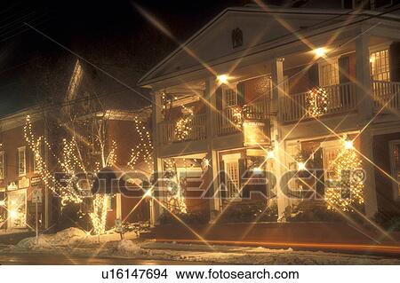 Picture -  inn, country inn, B&B, resort, Stowe, hotel, ski resort, holiday, Christmas, village, decorations, evening, snow, winter, Vermont, The Green Mountain Inn is decorated with white starlights for the Christmas holiday season in the village of Stowe on a sno. Fotosearch