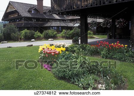 Stock Image -  inn, Trapp Family, flowers, lodging, spring, TFL, Stowe, VT, Vermont, Colorful flowers decorated the grounds of the Trapp Family Lodge in Stowe in the spring. . Fotosearch