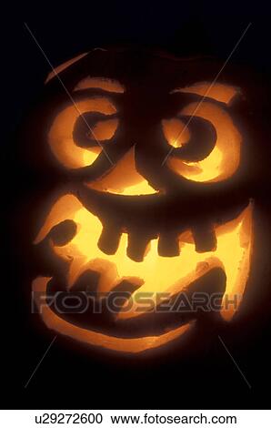 Jack-O-Lantern, close up, Halloween, pumpkin, display, fall decoration, A goofy close-up of a glowing jack-o-lantern decorated at night for Halloween at Settlement Farm Pumpkin Show in Middlesex in Washington County in the state of Vermont. View Large Photo Image Stock Image - Jack-O-Lantern, close up, Halloween, pumpkin, display, fall decoration, A goofy close-up of a glowing jack-o-lantern decorated at night for Halloween at Settlement Farm Pumpkin Show in Middlesex in Washington County in the state of Vermont. . Fotosearch