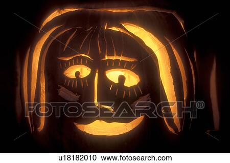 Jack-O-Lantern, close-up, pumpkin, Halloween, display, fall decoration, A glowing close up jack-o-lantern decorated like girl in the evening for Halloween at Settlement Farm Pumpkin Show in Middlesex in Washington County in the state of Vermont. View Large Photo Image Stock Image - Jack-O-Lantern, close-up, pumpkin, Halloween, display, fall decoration, A glowing close up jack-o-lantern decorated like girl in the evening for Halloween at Settlement Farm Pumpkin Show in Middlesex in Washington County in the state of Vermont. . Fotosearch