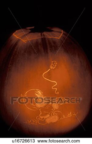 Stock Image -  Jack-O-Lantern, pumpkin, Halloween, fall decoration, display, carving, autumn, Carved glowing pumpkin decorated for Halloween at Ellie's Farm Pumpkin Show in Northfield in Washington County in the state of Vermont. . Fotosearch