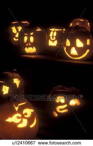 Stock Photo -  Jack-O-Lanterns, Halloween, pumpkins, autumn, display, fall decorations, Carved glowing jack-o-lanterns decorated at night for Halloween at Settlement Farm Pumpkin Show in Middlesex in Washington County in the state of Vermont. . Fotosearch