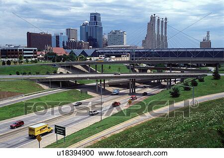 Stock Image -  Kansas City, skyline, expressway, MO, Missouri, downtown skyline of Kansas City and I-670/I-35.. Fotosearch