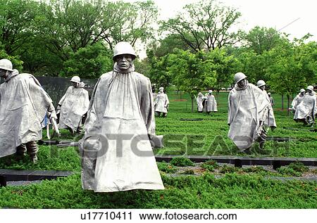 Stock Image -  Korean War Memorial, Washington, DC, District of Columbia, Statues of soldiers in ponchos in a rice paddy field at the Korean War Veterans Memorial.. Fotosearch