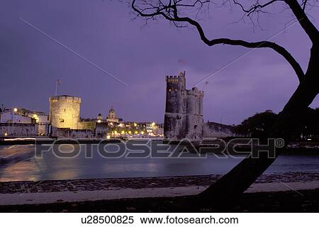La Rochelle, France, Poitou-Charentes, Charente-Maritime, Europe, 14th century medieval stone towers illuminated at night at the entrance to the harbor of the ancient fortified old port city of La Rochelle on the Atlantic Ocean. View Large Photo Image Stock Photography - La Rochelle, France, Poitou-Charentes, Charente-Maritime, Europe, 14th century medieval stone towers illuminated at night at the entrance to the harbor of the ancient fortified old port city of La Rochelle on the Atlantic Ocean.. Fotosearch