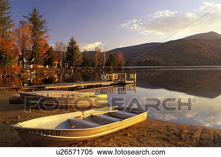 lake, boats, Adirondacks, New York, Blue Mountain Lake, NY, A canoe and two rowboats on the beach on Blue Mountain Lake in the fall in the Adirondacks. View Large Photo Image Stock Photography - lake, boats, Adirondacks, New York, Blue Mountain Lake, NY, A canoe and two rowboats on the beach on Blue Mountain Lake in the fall in the Adirondacks.. Fotosearch