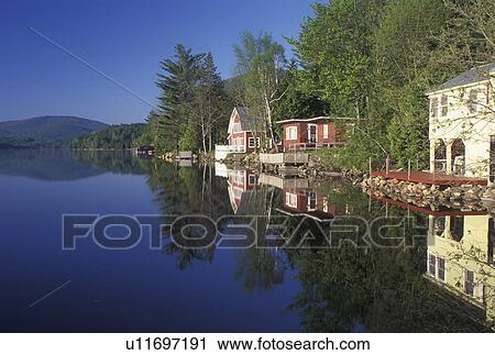 lake, cottages, summer, West Barnet, VT, Vermont, Reflection of summer cottages along Harveys Lake in West Barnet in the spring. View Large Photo Image Stock Image - lake, cottages, summer, West Barnet, VT, Vermont, Reflection of summer cottages along Harveys Lake in West Barnet in the spring.. Fotosearch