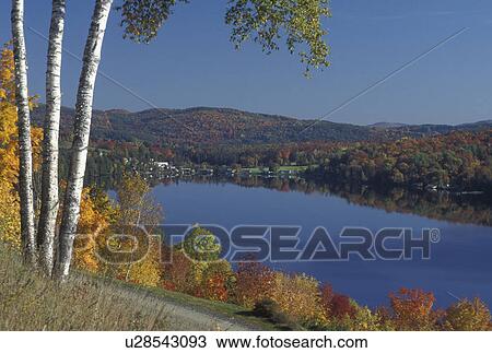 Stock Image -  lake, fall, Barnet, VT, Vermont, Scenic view of the colorful foliage around Harveys Lake in the autumn.. Fotosearch