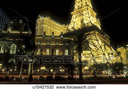 Stock Image -  Las Vegas, Nevada, Paris Casino & Resort, NV, Replica of the Eiffel Tower and other landmarks at Paris Las Vegas Resort & Casino on The Strip at night in Las Vegas, the Entertainment Capital of the World.. Fotosearch