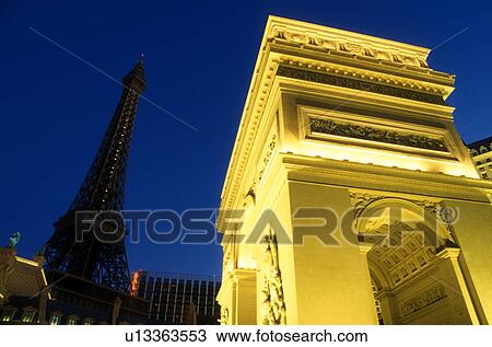 Stock Image -  Las Vegas, Nevada, Paris Casino & Resort, NV, Replica of the Eiffel Tower and Arc de Triomphe at Paris Las Vegas Resort & Casino on The Strip at night in Las Vegas, the Entertainment Capital of the World.. Fotosearch