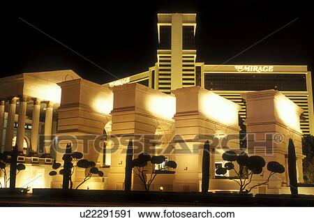 Stock Image -  Las Vegas, Nevada, The Mirage, casino, NV, The Strip, The Mirage Hotel & Casino on The Strip at night in Las Vegas, the Entertainment Capital of the World.. Fotosearch