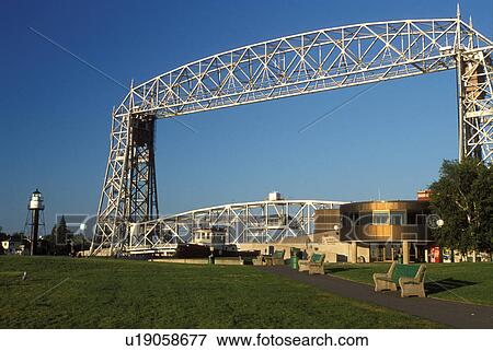 Stock Photo -  lift bridge, Duluth, MN, Minnesota, Canal Park Marine Museum and the Aerial Lift Bridge at Canal Park in Duluth.. Fotosearch