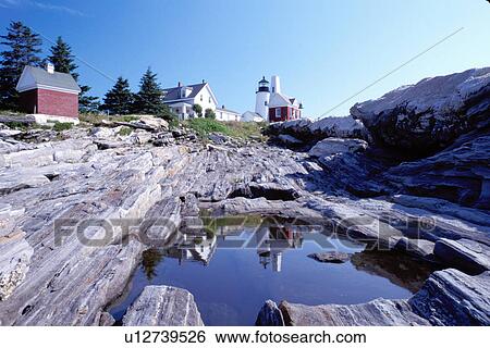 Stock Photograph -  lighthouse, Maine, ME, Pemaquid Point, Bristol, Pemaquid Head Light reflects in a pool of water along the rocky coast of the Atlantic Ocean.. Fotosearch