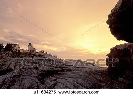 Stock Photography -  lighthouse, Maine, sunrise, sunset, Pemaquid Point, Bristol, ME, Pemaquid Head Light at sunrise along the rocky coast of the Atlantic Ocean.. Fotosearch