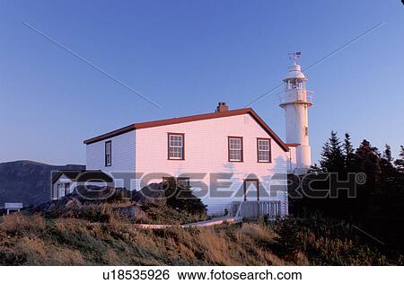 Stock Photograph -  lighthouse, Newfoundland, NF, Canada, Lobster Cove Head Lighthouse on the Gulf of St. Lawrence at sunset. Gros Morne National Park.. Fotosearch