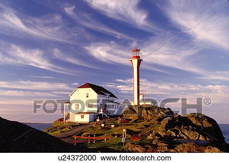 lighthouse, Nova Scotia, Yarmouth, NS, Canada, Cape Forchu Lighthouse along the coast in Yarmouth at sunrise on the Atlantic Ocean. View Large Photo Image Stock Image - lighthouse, Nova Scotia, Yarmouth, NS, Canada, Cape Forchu Lighthouse along the coast in Yarmouth at sunrise on the Atlantic Ocean. . Fotosearch