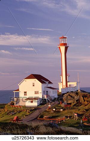 Stock Image -  lighthouse, Nova Scotia, Yarmouth, NS, Canada, Cape Forchu Lighthouse along the coast in Yarmouth at sunrise on the Atlantic Ocean. . Fotosearch